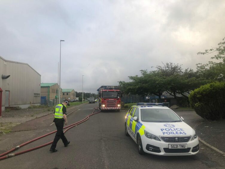 Police and fire crews at Wester Gourdie Industrial Estate