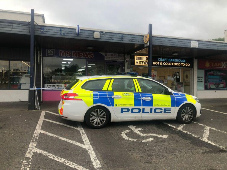 Police remain at the scene following the break-in at MS News in Broughty Ferry.