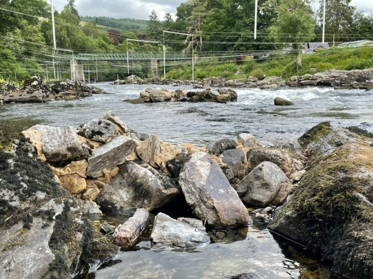 Concrete blocking up rocks in the River Tay at Grandtully.
