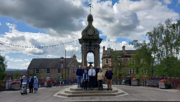 members of restoration group next to Murray Fountain in Crieff's James Square.
