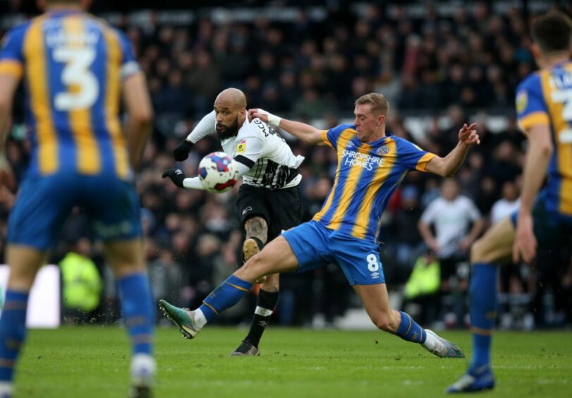 Phillips was Shrewbury's Young Player of the Year last season. Here he challenges David McGoldrick of Derby in League One. Image: PA.
