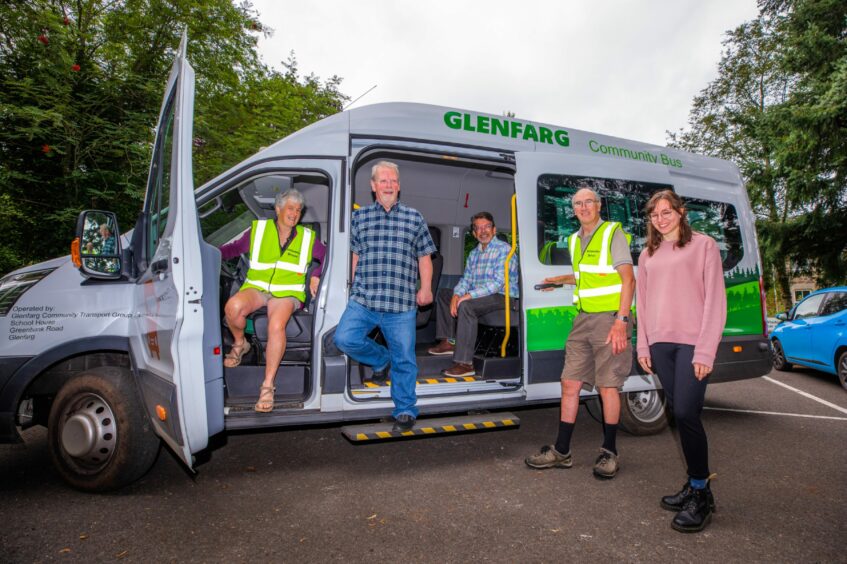 Glenfarg Community transport Group members in front of their mini bus.