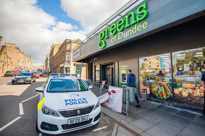 Police outside the Greens of Dundee store in Stobswell after a break-in