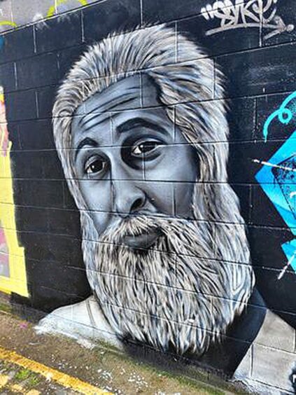Navid (Sanjeev Kohli) mural by Dundee graffiti artist Syke.