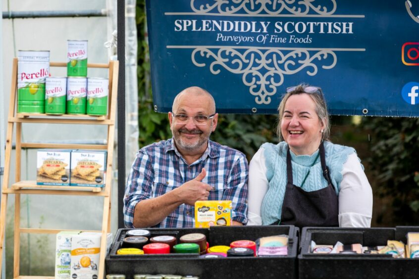 Douglas MacGregor and Sara Brand behind the counter of the Splendidly Scottish mobile deli at the Barrie Box summer fair.