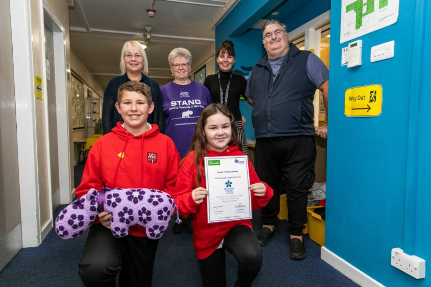 Pictured are: Ruth McCabe (second from the left) with Gerry King at Leslie Primary School, Fife, in October last year when they did a presentation on dementia to schoolchildren.