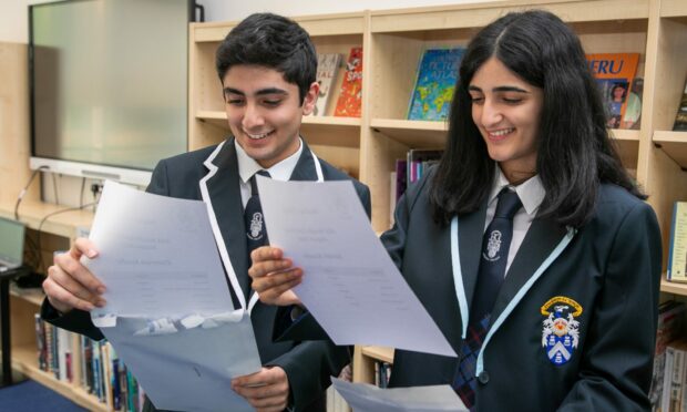 Twins Camran and Sarah Kouhy were among the Madras College pupils to open their results in front of television cameras. Image: Steve Brown/DC Thomson.
