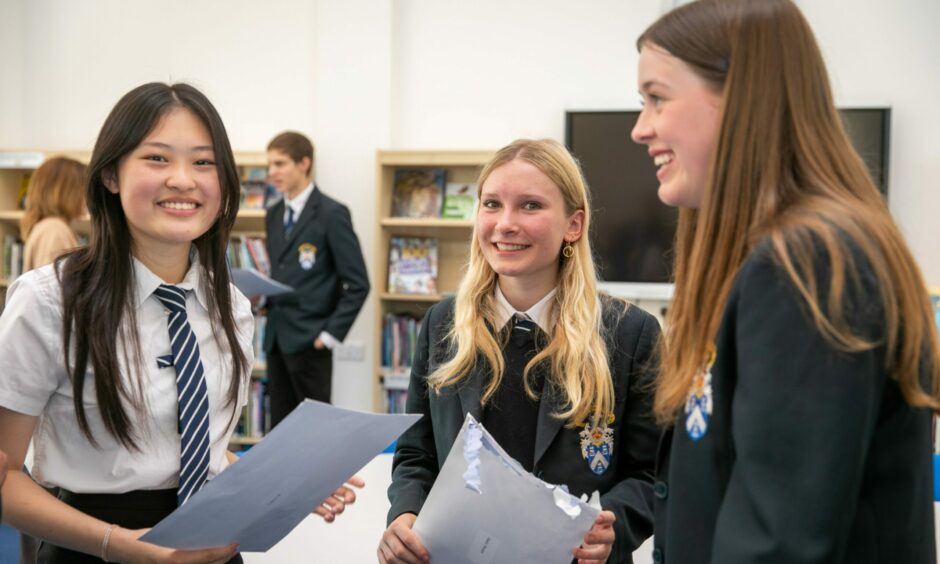 Madras College pupils Lucy Lin, Emily Moore and Maddie Johnston, all 16, were among those celebrating exams success. Image: Steve Brown/DC Thomson.