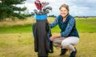 Image shows Sophie Mifsud with her Everyday Heirloom Grandma's golf bag and clubs. Sophie is crouching beside the bag and smiling broadly.