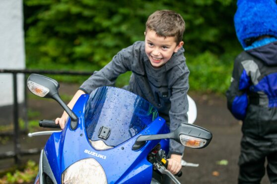 Max Simonetti looking delighted on a motorbike.
