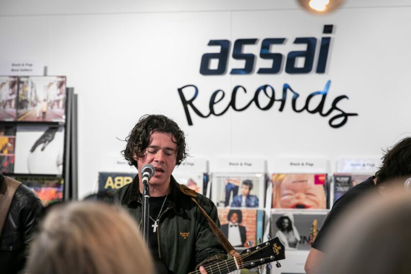 The View frontman Kyle Falconer starts their performance at Assai Records.