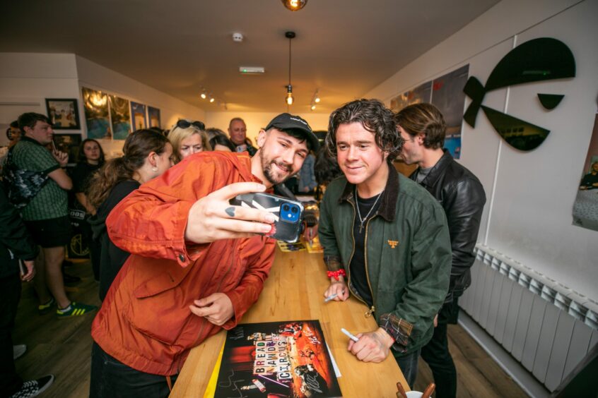 The View singer Kyle Falconer gets a selfie with a fan during a Dundee in-store performance