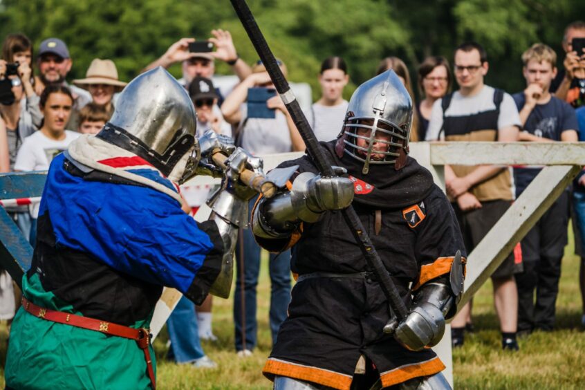 Members of the Knight League fighting with medieval weapons at Perth Highland Games in 2022.