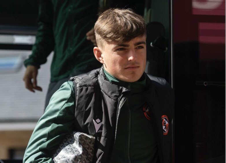 Lewis O'Donnell exiting the Dundee United team bus. 