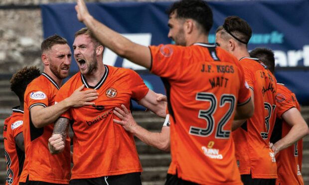 Dundee United players celebrate Kevin Holt's goal against Ayr United