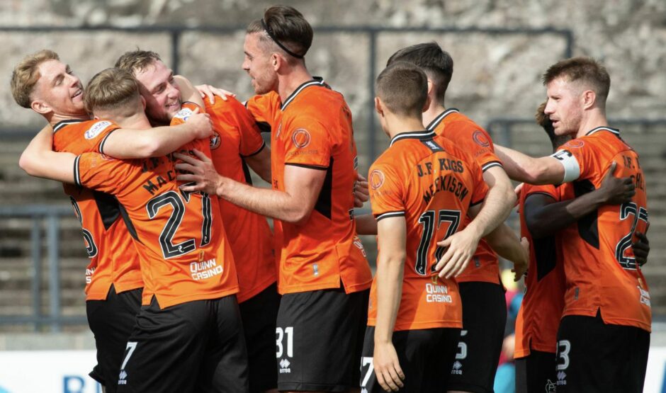 Dundee United players celebrate against Ayr United 