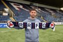 Shaun Byrne stands with a Raith Rovers scarf at Stark's Park. Image: Raith Rovers.