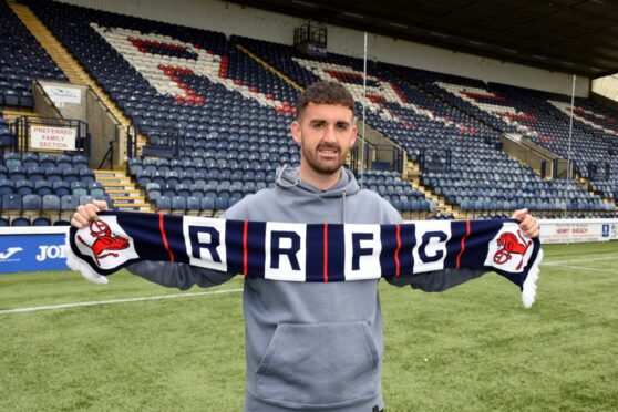 Shaun Byrne stands with a Raith Rovers scarf at Stark's Park. Image: Raith Rovers.