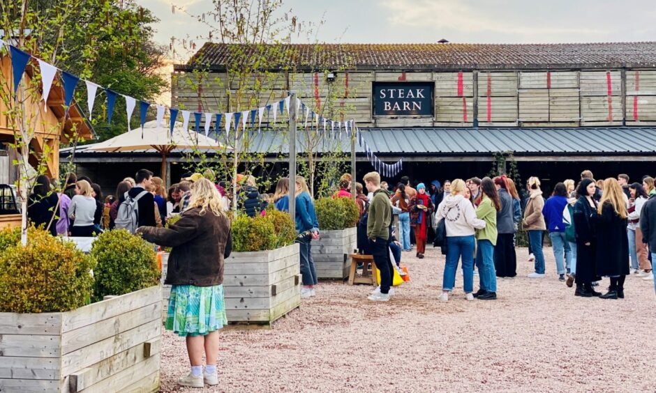 The outside of Balgove Larder's Steak Barn as people check out the night market