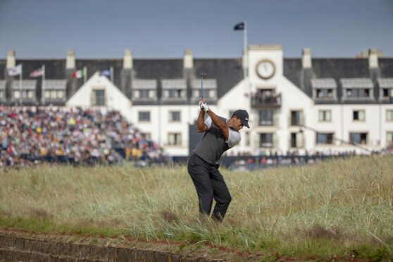 Tiger Woods hits an approach to the 18th during the 147th Open Championship at Carnoustie in 2018. Image: SNS