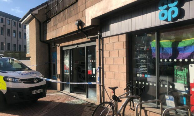 Police outside the Co-op on Brook Street in Dundee. Image: Poppy Watson/DC Thomson