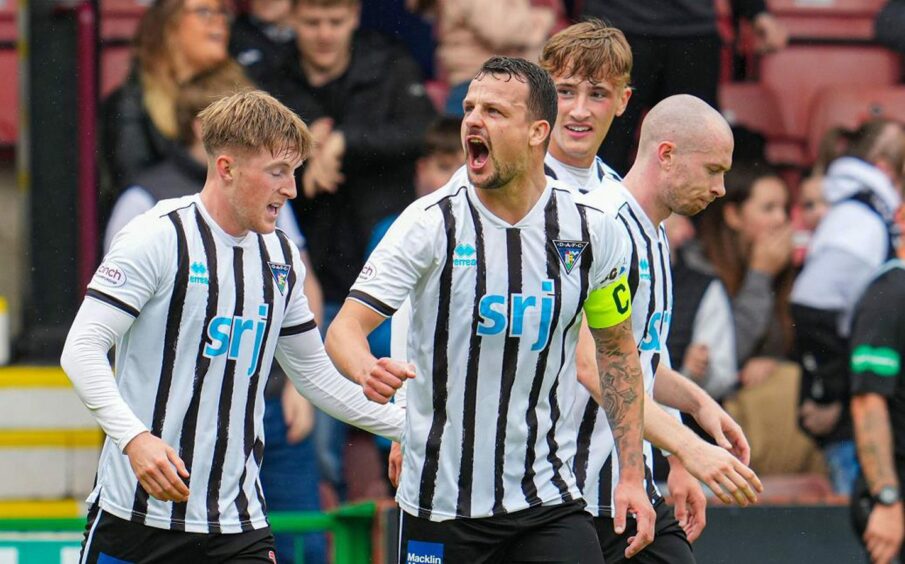 Kyle Bendictus roars in the direction of supporters celebrating a Dunfermline goal earlier this season. Image: SNS.