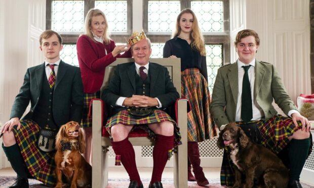 From left: Bruce, Paula, Mike, Lucy and Rory with their dogs Poppy and Bertie Image: BBC Scotland.