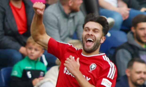 Ex-St Johnstone forward Connor McLennan is up and running with new club Salford City.