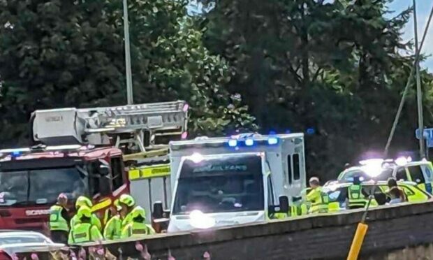 Police and Fire on the scene at the crash involving a car and a lorry in Crossgates, Fife