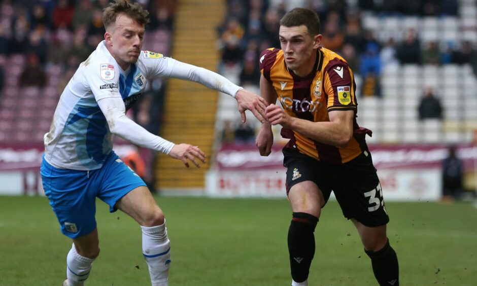 New St Johnstone signing Dara Costelloe driving at a defender with Bradford.