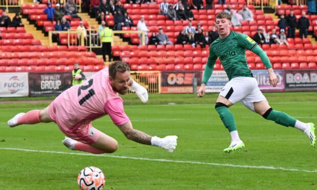 Jay Turner-Cooke scores for Newcastle United against Gateshead.