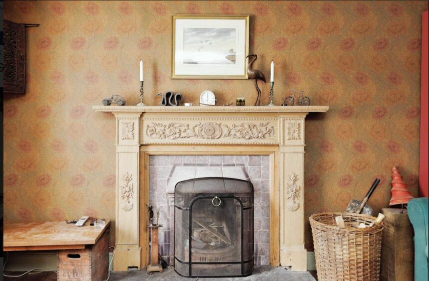 The downstairs living room features a beautiful stove