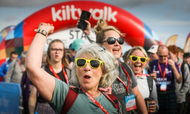 Walkers leave the start line of the Mighty Stride with big smiles on their faces. Image: Mhairi Edwards/DC Thomson