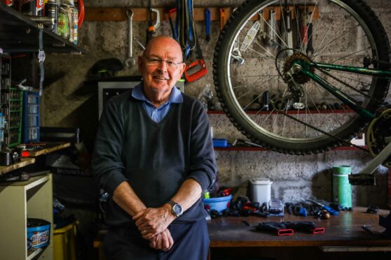 Alan Bruce, 76, has been taking in bikes and repairing them for 12 years. Image: Mhairi Edwards/DC Thomson