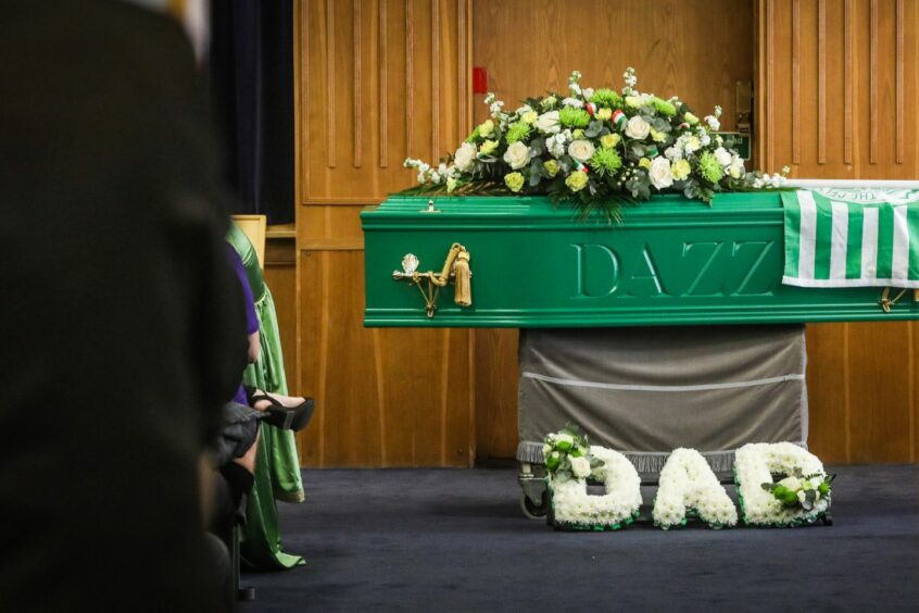Darien Baird's green coffin at his funeral in Brechin