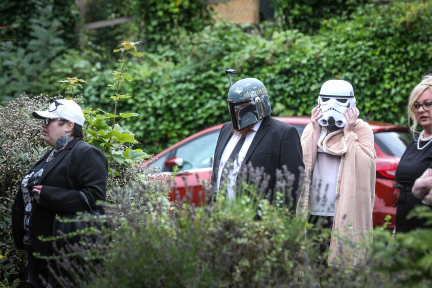 Loved ones of Darien Baird at his Star Wars-themed funeral in Brechin