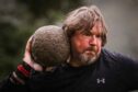 Ian Smith throwing the stone at Glenisla Games. Image: Mhairi Edwards/DC Thomson