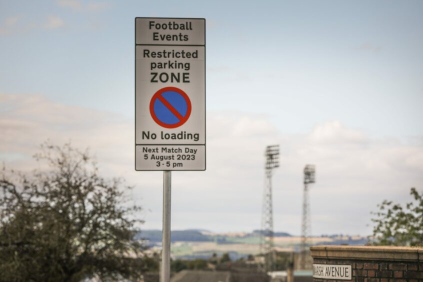 Football restricted parking sign in Dundee near Dens Park and Tannadice