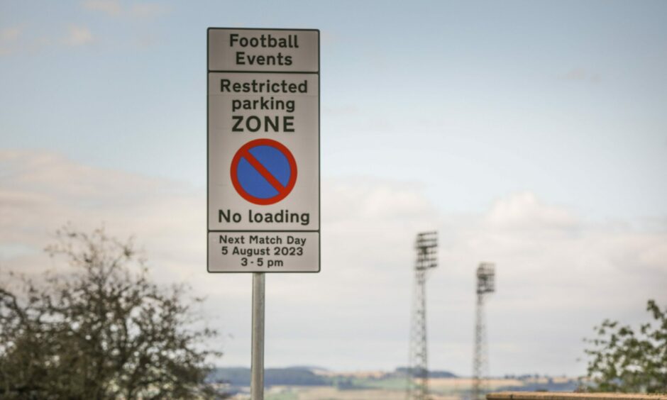 Football restricted parking sign in Dundee near Dens Park and Tannadice