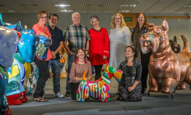 Some of the Scotties by the Sea artists together with project manager Jane Kennedy (far right top row) and artist coordinator Rio Moore (far right bottom row).
