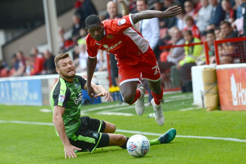 Amadou Bakayoko takes on former Dundee United captain Ryan Edwards as a Walsall player against Plymouth Argyle in 2017. Image: Shutterstock