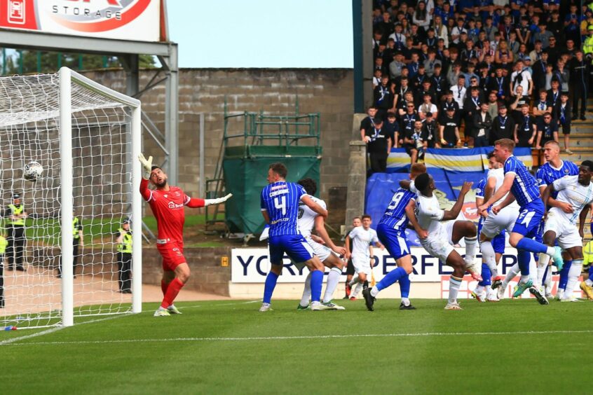 Lamie powers in a second goal for Dundee. Image: David Young/Shutterstock