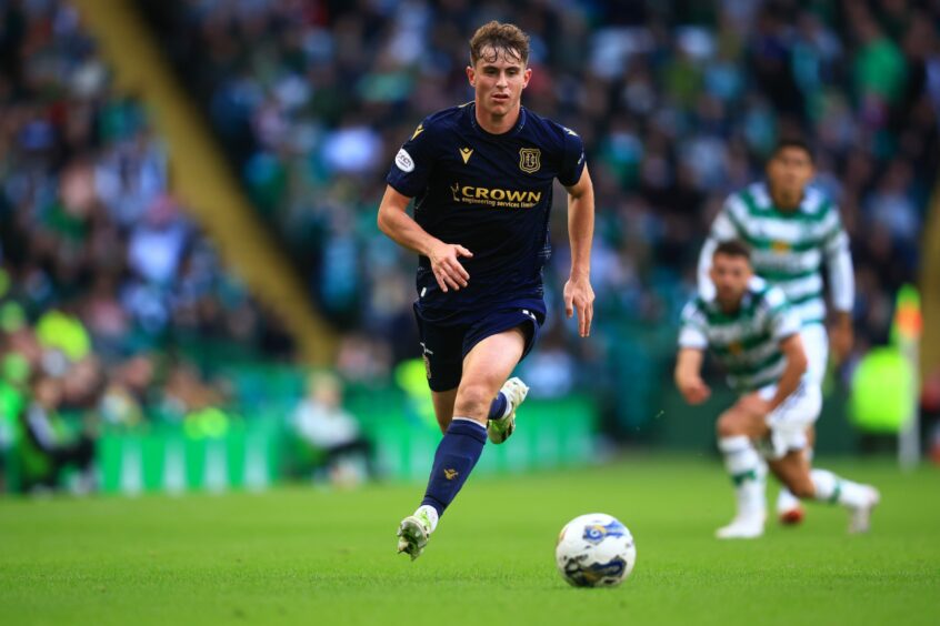 Fin Robertson takes on Celtic. Image: David Young/Shutterstock