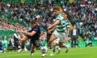Dundee FC midfielder Ryan Howley takes on Celtic's Matt O'Riley. Image: David Young/Shutterstock