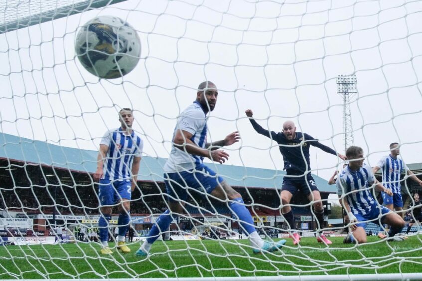 Zak Rudden finds the back of the net late in stoppage time. Image: David Young/Shutterstock