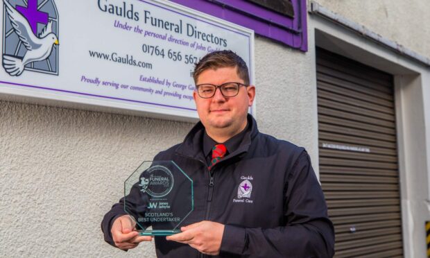 John Gordon with his award for Scotland's best undertaker. Image: Steve MacDougall/DC Thomson