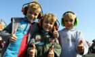 Jack McLean, Harry McLean and Matthew Leitch enjoying the Diamond Jubilee Airshow in 2012. Image: DC Thomson.
