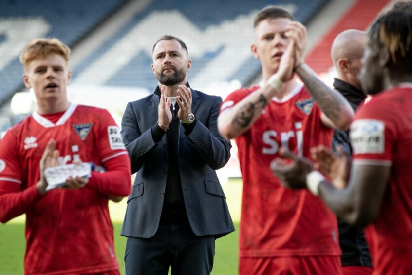 Dunfermline Athletic manager James McPake and his players applaud the fans after the Queen's Park game. Image: Craig Brown/DAFC.