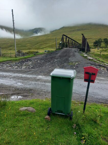 Grey lidded bin in highland Perthshire.