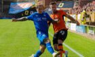 Scott McMann of Dundee United in action against Peterhead